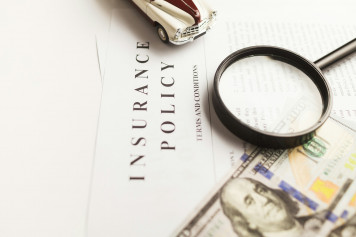 a magnifying glass sitting on top of a piece of paper