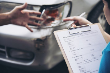 insurance agent working during on site car accident claim process