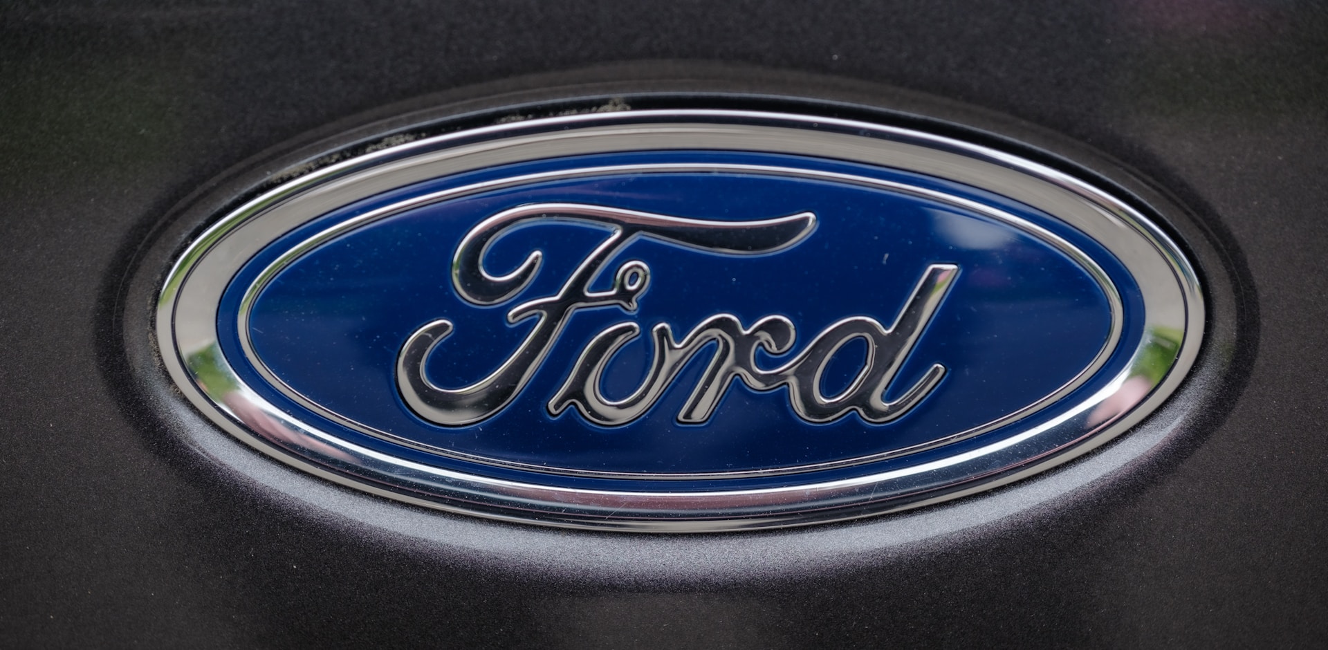 a close up of a ford emblem on a car