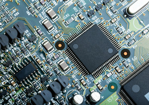 closeup of electronic circuit board with cpu microchip electronic components background